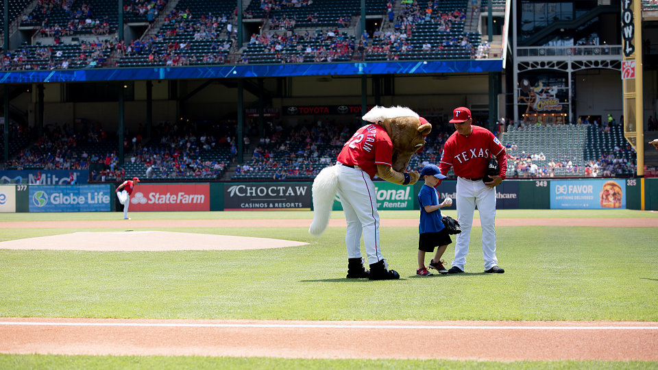 5 year old adopted through buckner international throws out ceremonial first pitch at texas rangers