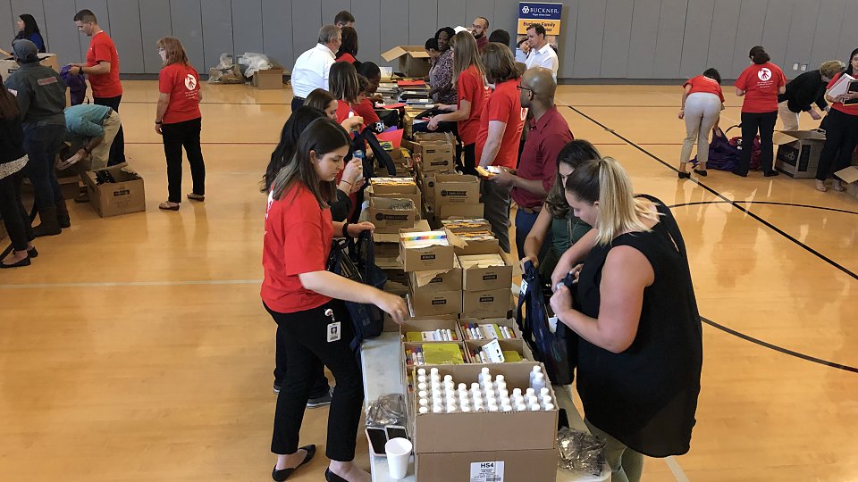 halliburton employees filled 760 backpacks with supplies for children served by buckner