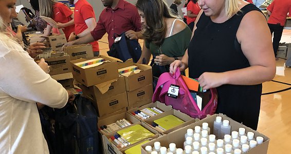 Halliburton Employees fill and donate 760 backpacks with school supplies for children served by Buckner