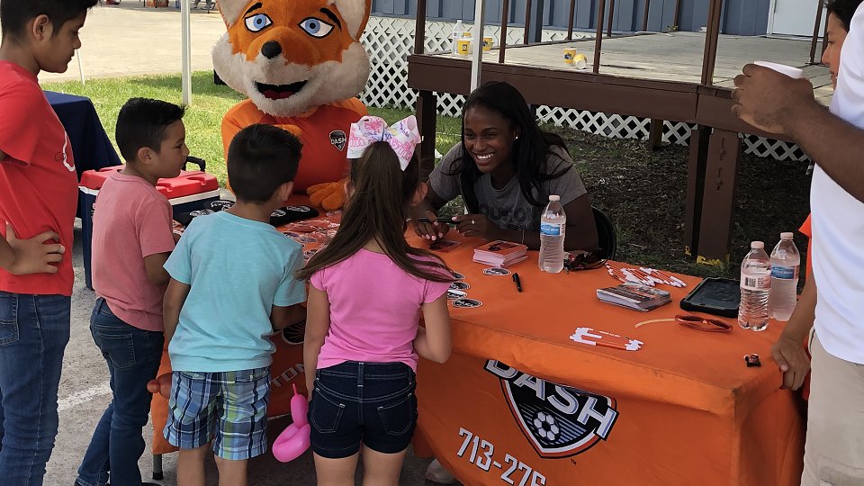 houston dash player nichelle prince signs autographs for children with family hope center