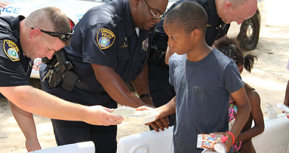 Longview Police Department Play Nice Guys at Buckner Feeding Program
