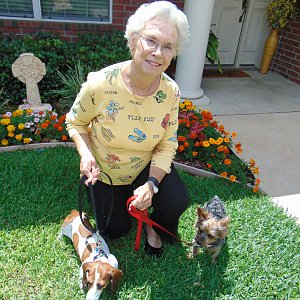 Sandy Taylor outside her Calder Woods townhome with dachshund Princess and Yorkie Benji.