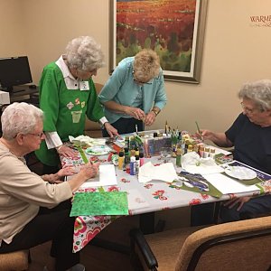 Painting masterpieces at a Buckner Villas painting class.