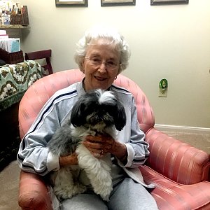 Edna Hooker of Buckner Westminster Place with her dog, Toby.