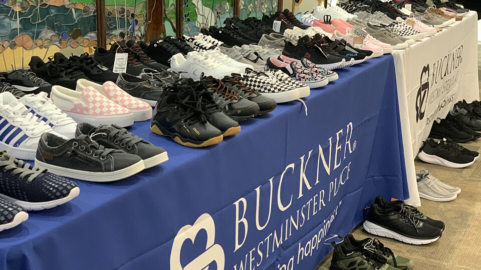 buckner westminster place donates shoes for vulnerable children