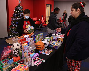 families shop for toys at the buckner christmas market in dallas