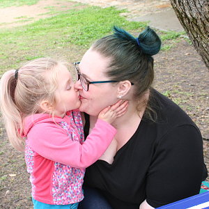 child-kisses-mom-during-camp-buckner.jpg