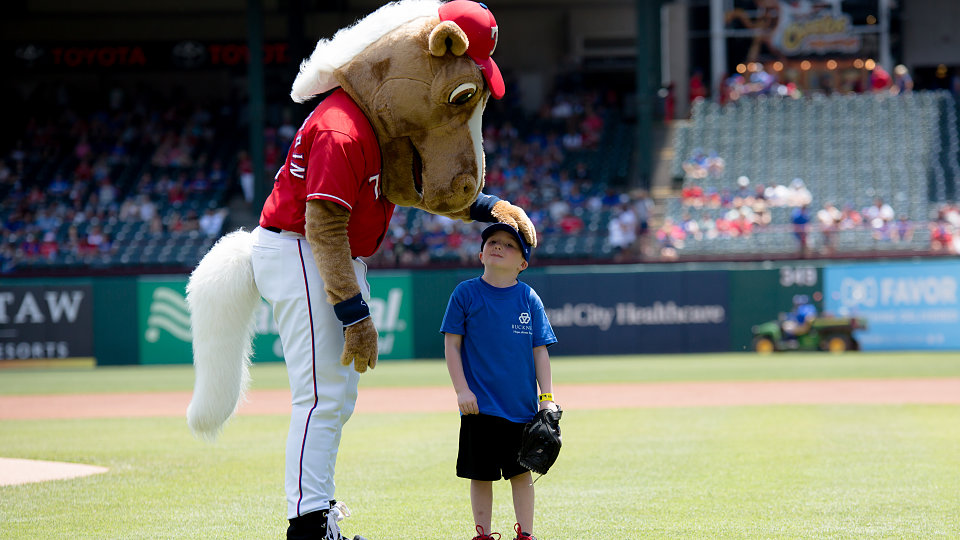 rangers mascot captain greets 5 year old adopted by buckner