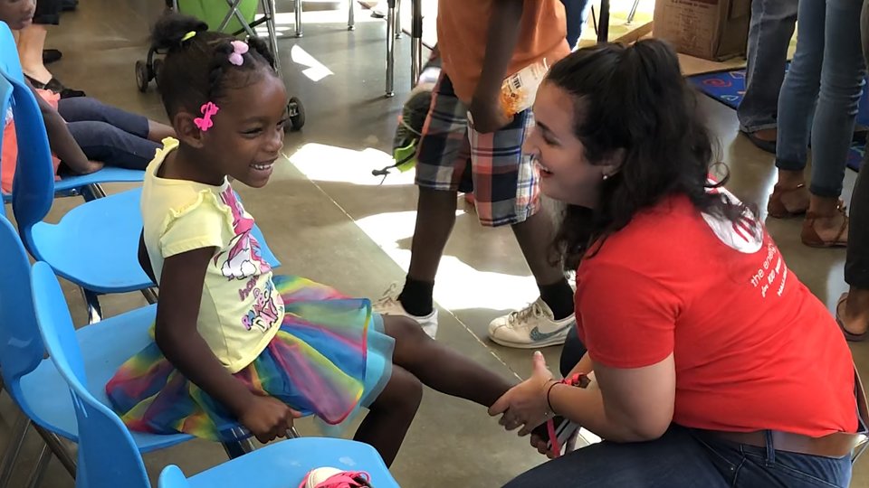 volunteers helped outfit buckner family hope center kids with new shoes for school