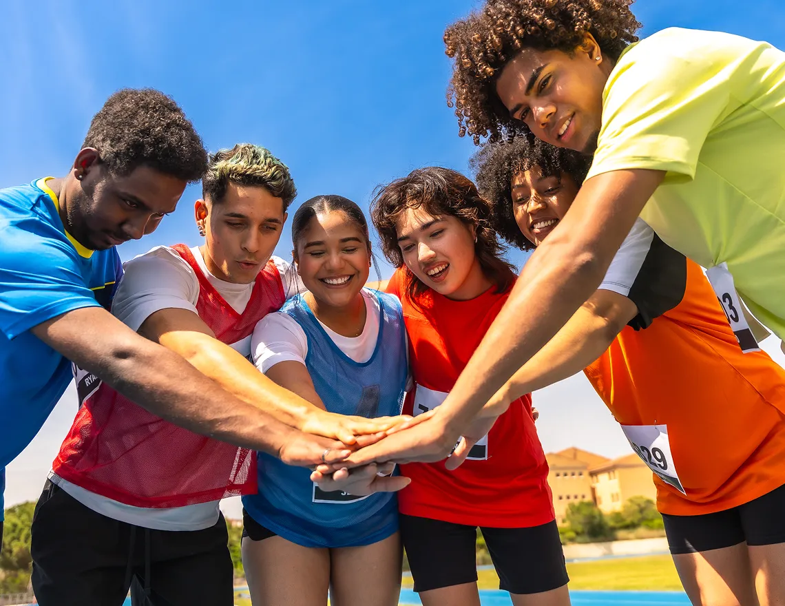 athletes-joining-hands-in-a-circle-teamwork-and-u-2025-06-13-19-35-06-utc