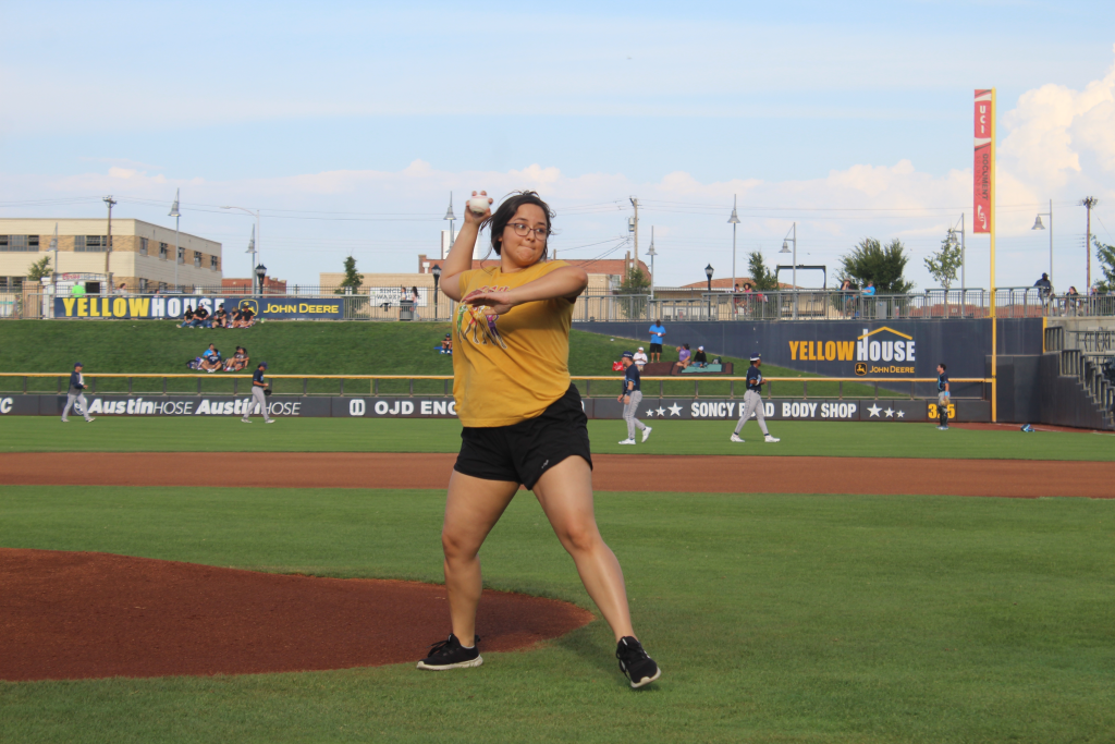 Buckner FYi alumni throws first pitch