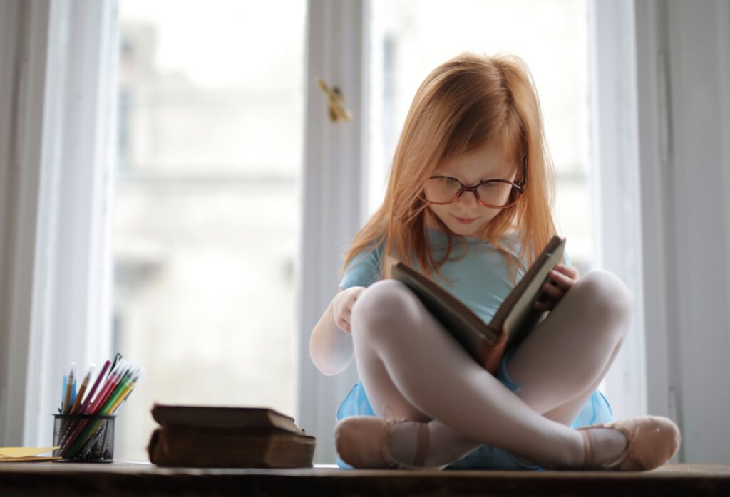 girl-in-blue-dress-reading-a-book-3887493