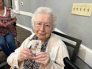 Grace Raney and photo of granddaughter