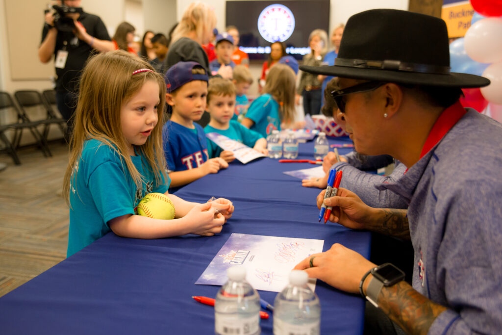 jesse-chavez-autographs-a-softball-for-a-young-fan