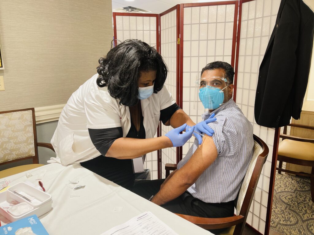 photo-of-abraham-mathew-the-executive-director-of-parkway-place-receiving-vaccine