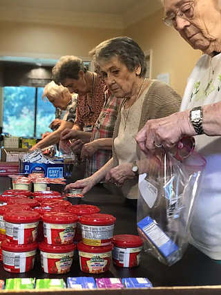 residents-at-westminster-place-pack-snacks-for-local-students