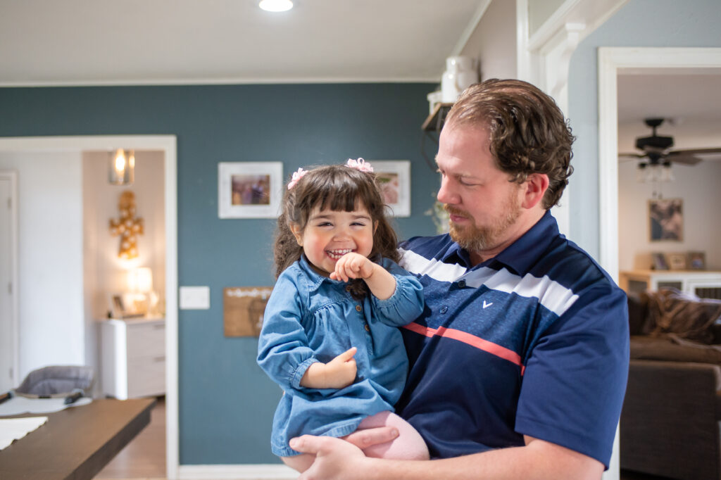 Trinity Sappington with Jarrett her recently adopted dad.  [Shaie Williams for Buckner International]