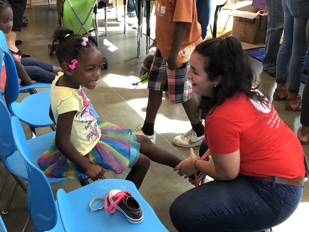 volunteers-helped-outfit-buckner-family-hope-center-kids-with-new-shoes-for-school