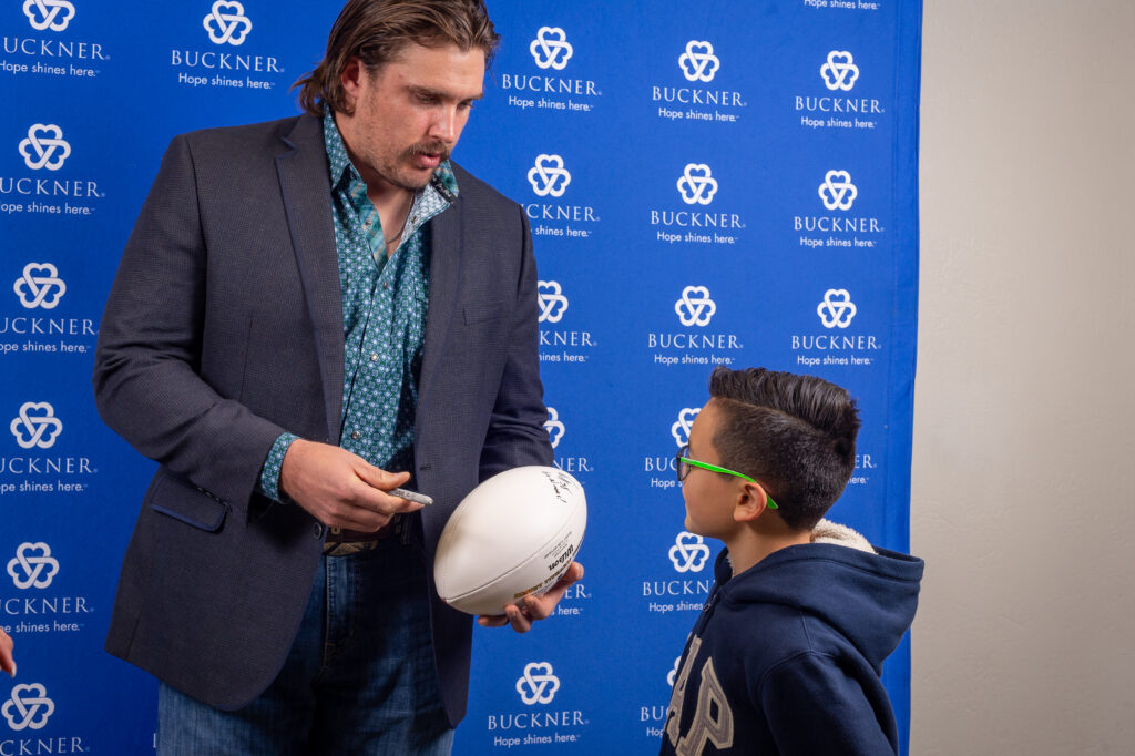 weston-richburg-signs-football-for-young-fan