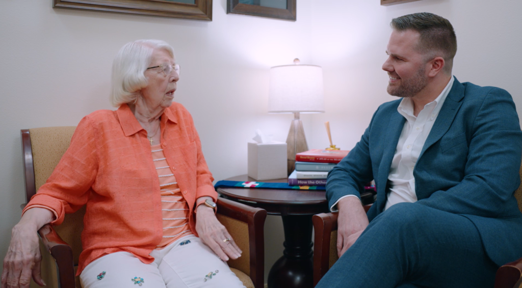 chaplain listening intently to senior in retirement community
